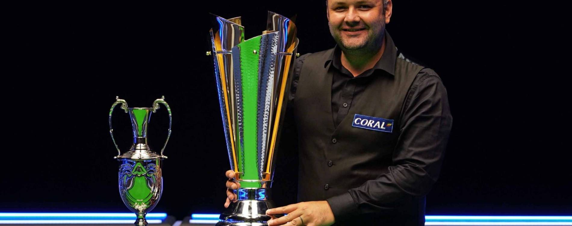 Stephen Maguire stands victorious at the Tour Championship