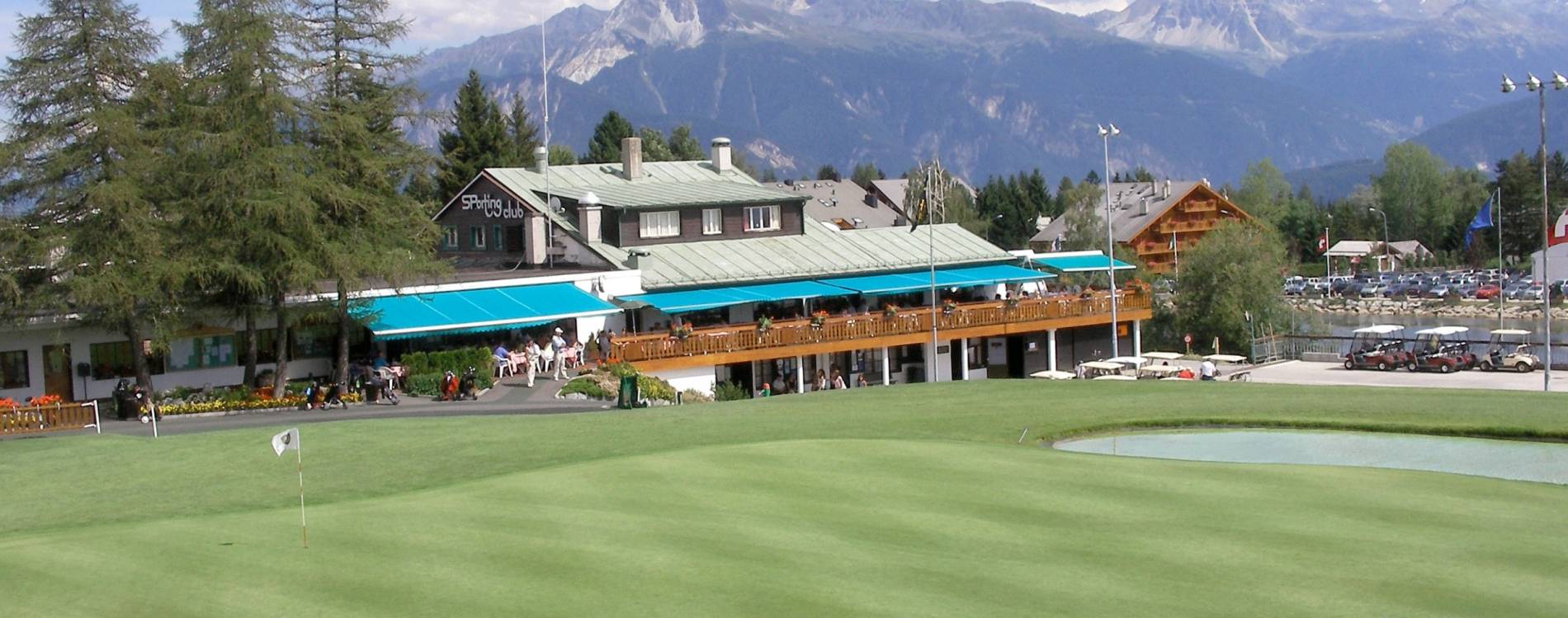 The 18th green and clubhouse at Crans-sur-Sierre Golf Club