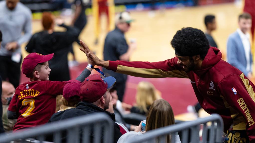 The Cleveland Cavaliers' Jarrett Allen high-fives a child
