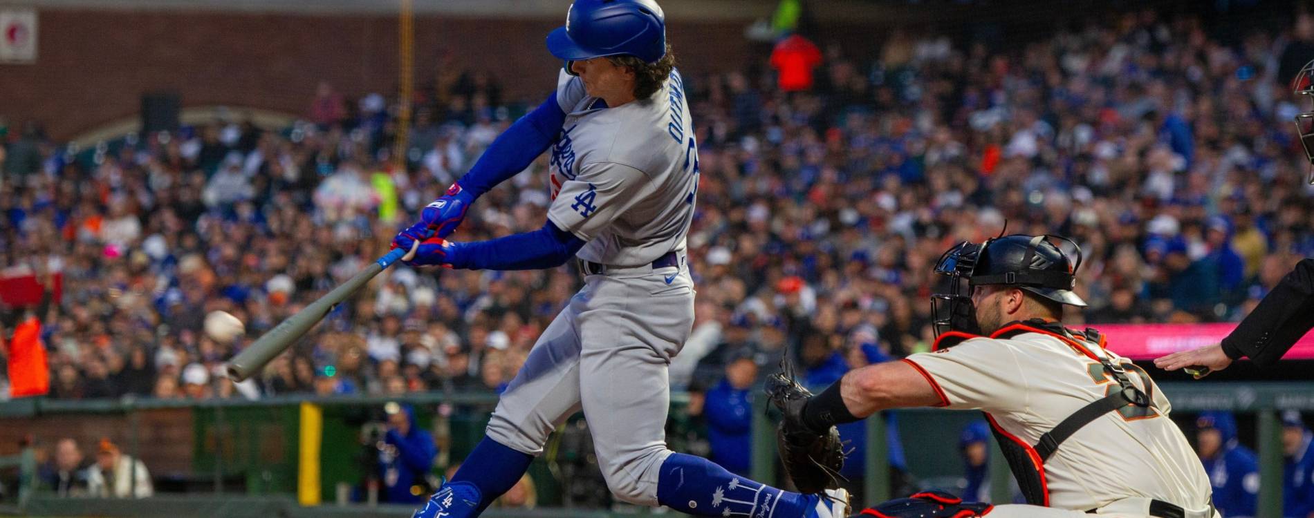 The LA Dodgers' James Outman hits a triple against the San Francisco Giants