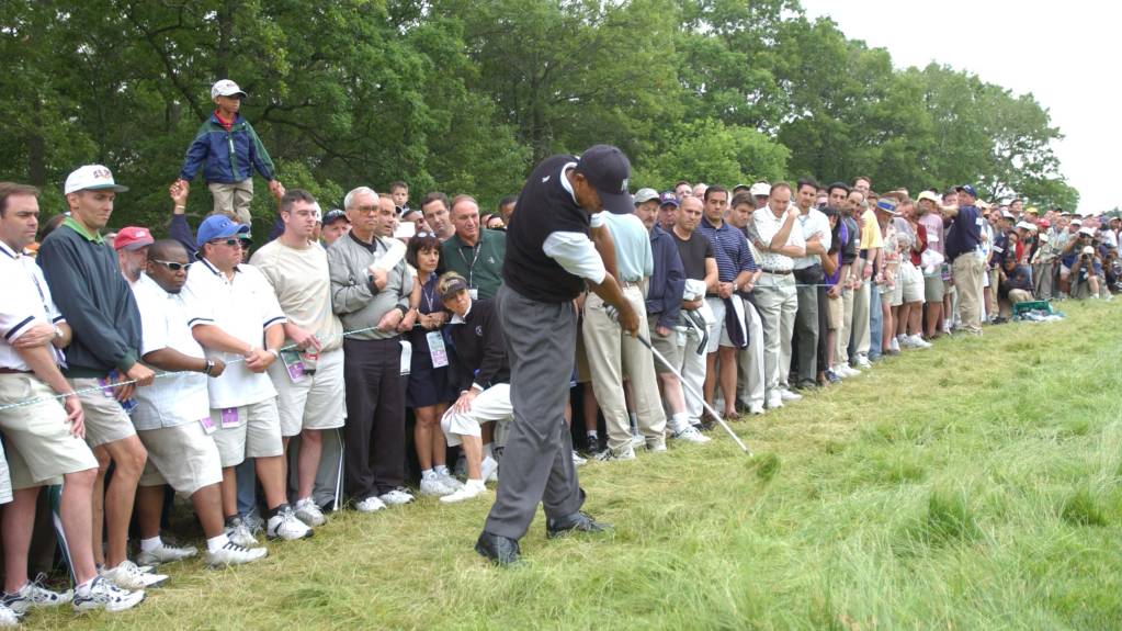 Tiger Woods playing out of the rough