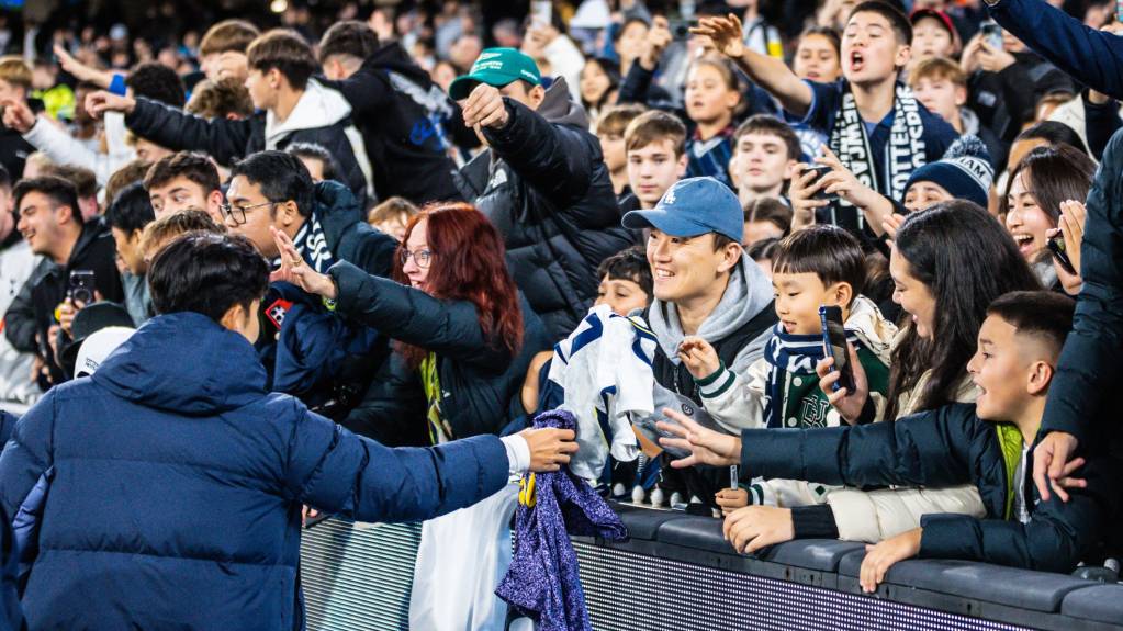 Tottenham Hotspur's Heung-Min Son gives his shirt to fans