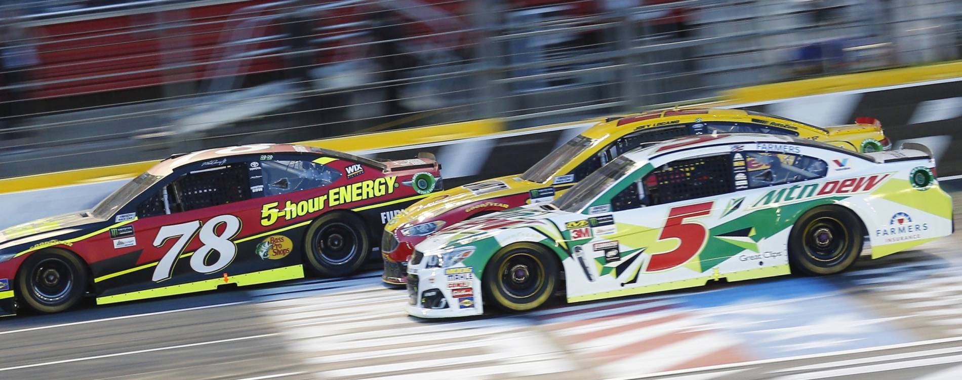 Truex Jr, Logano, and Kahne battling at Charlotte Motor Speedway