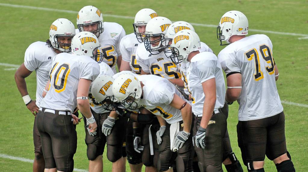 Valparaiso University football players in a huddle during a game against the University of San Diego