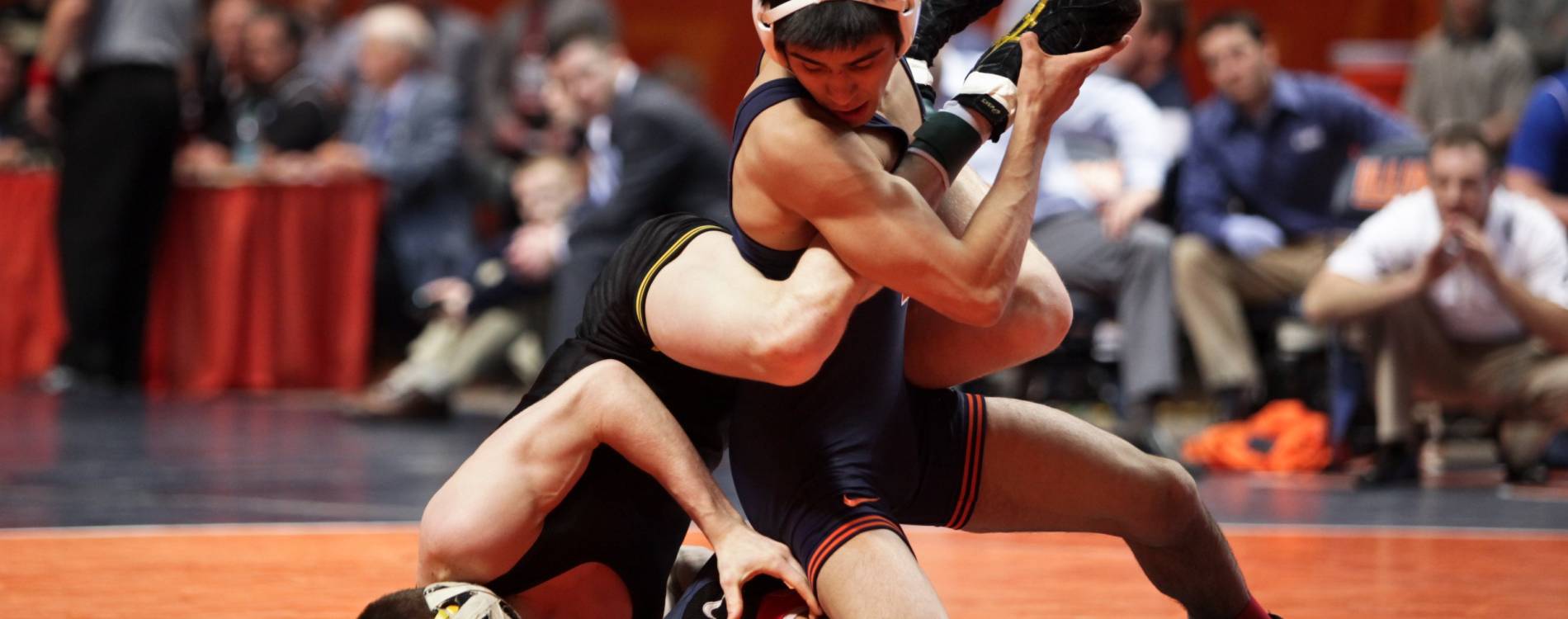 Wrestlers grapple at an NCAA competition