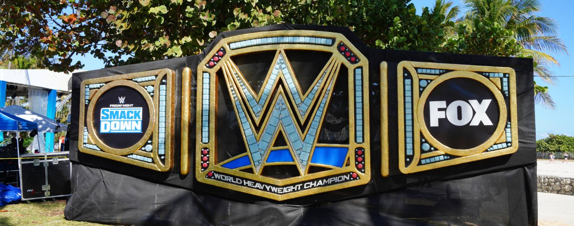 WWE Championship statue next to the beach